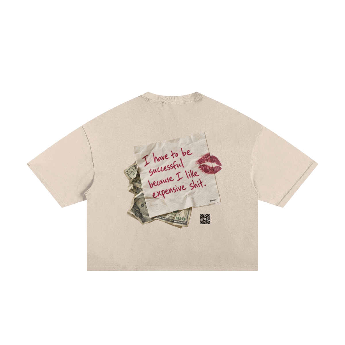 Apricot frayed boxy T-shirt, back view with handwritten Expensive Shit message on a note with money and a lipstick kiss.