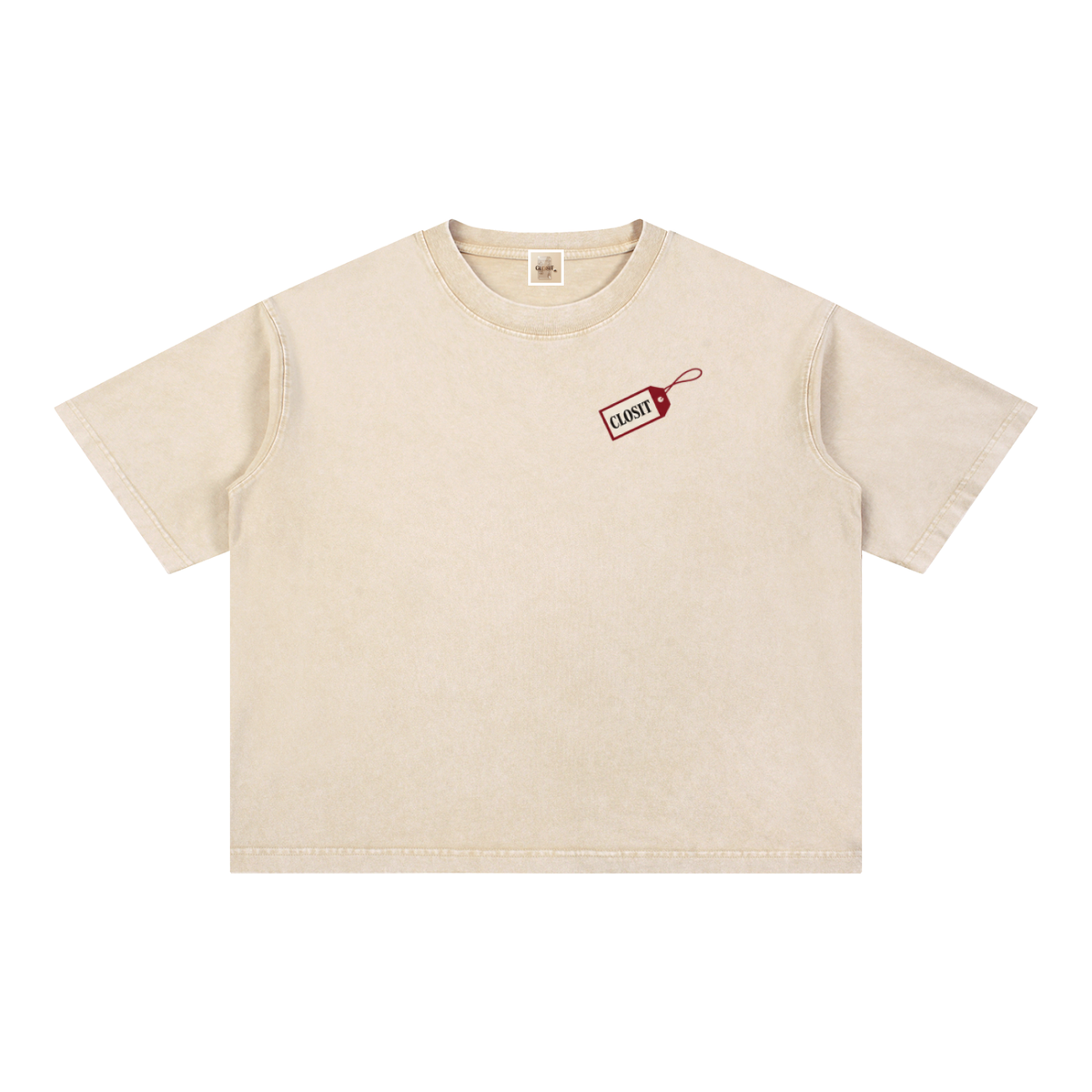 Front of the light apricot oversized tee with a small red Closit tag graphic on the chest.