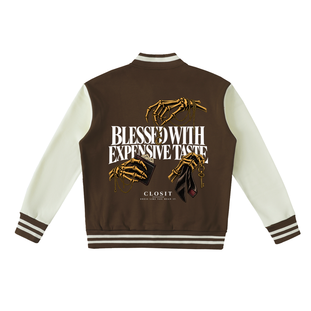 Coffee and white varsity jacket, back view with Blessed with Expensive Taste slogan and gold skeletal hands.