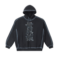 Washed Black VISION hoodie, front view with vertical Japanese lettering and contrasting faded seams.