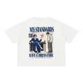 Back of the white oversized tee with My Standards Have a Dress Code text and a style-review illustration.