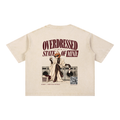 Light Apricot oversized T-shirt, back view with Overdressed Is a State of Mind slogan and cat seated on washing machines.